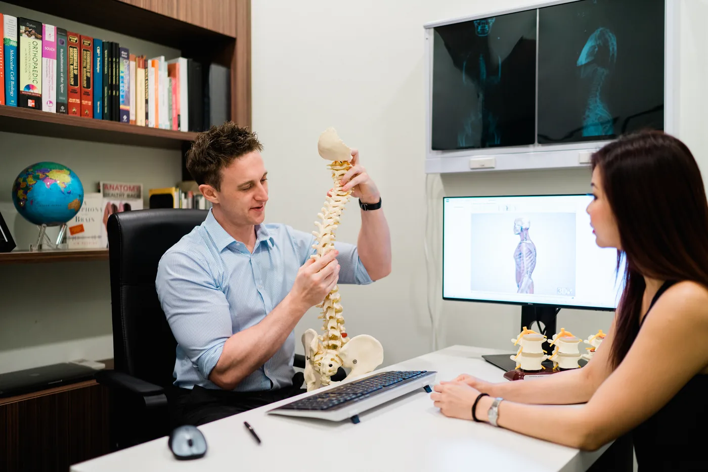 The Functional Correction Method in delivery — a doctor assessing and treating a patient at Elite Spine Centres.