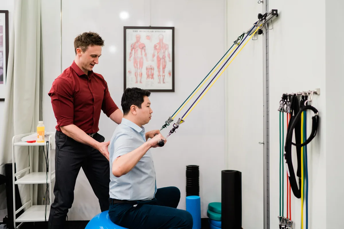 Rehabilitative exercise being delivered to a patient at Elite Spine Centres.
